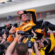 McLaren’s Lando Norris is lifted after winning the Miami Grand Prix (Rebecca Blackwell/AP)